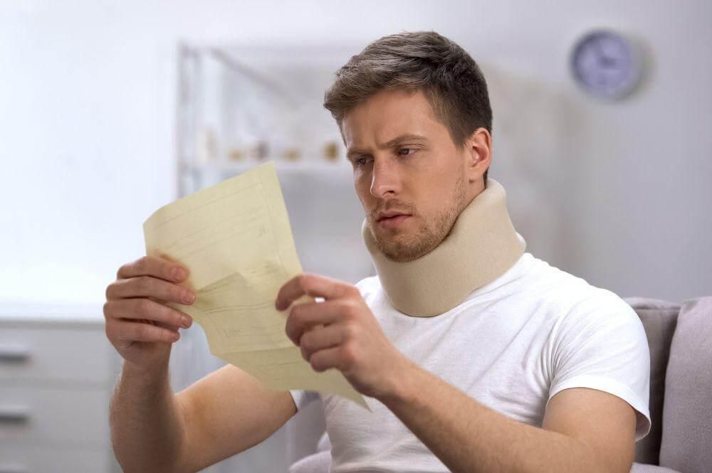 Michigan car accident victim in a neck brace