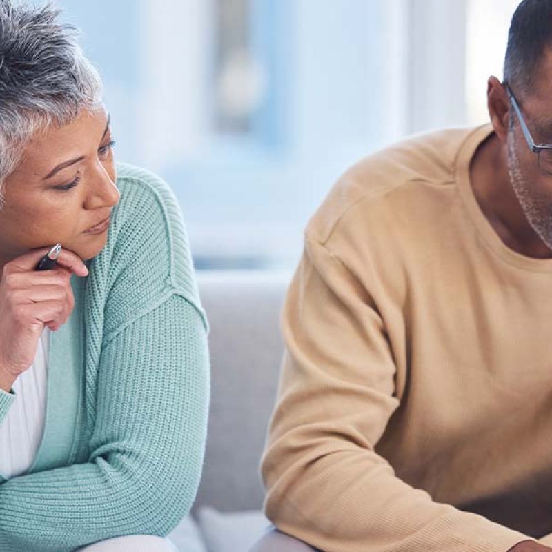 husband and wife reading a medical bill
