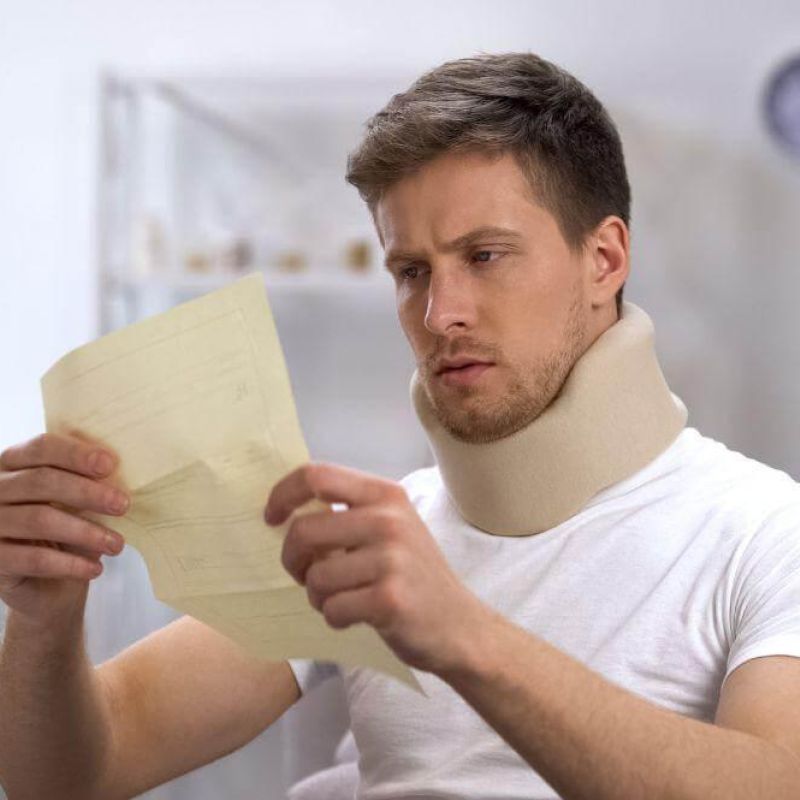 Michigan car accident victim in a neck brace