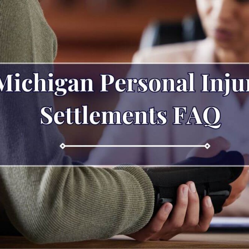 A person holds a black object, engaging in discussion with another individual in a professional setting. The text overlay reads, "Michigan Personal Injury Settlements FAQ."