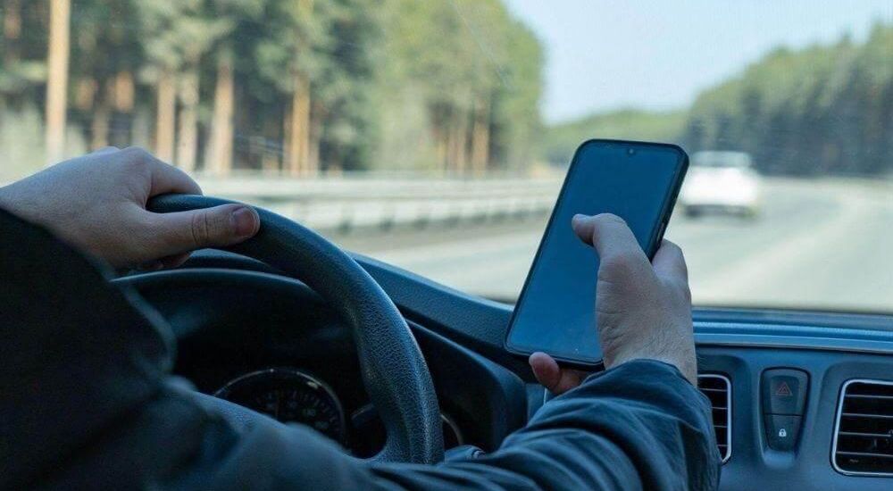 Driver using cell phone, a common form