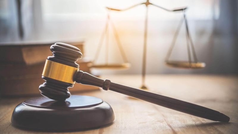 Judge's gavel on wooden table