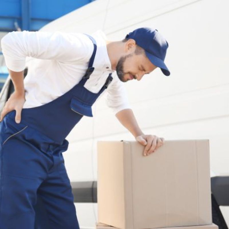 Postal worker holding his back in pain