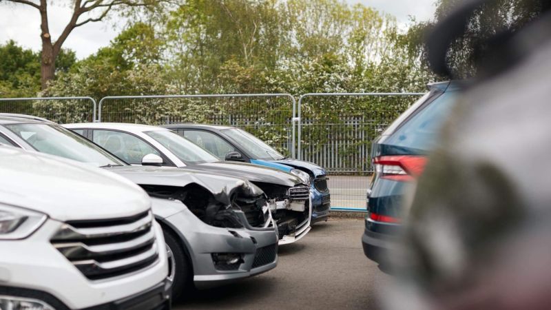 a bunch of cars that are parked in a lot