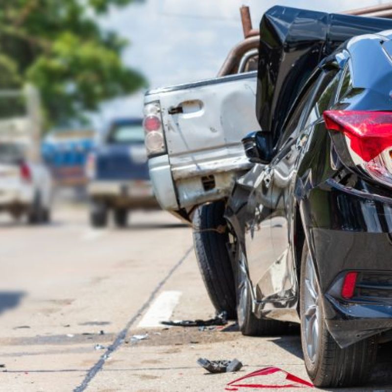 car in a rear end accident with a truck