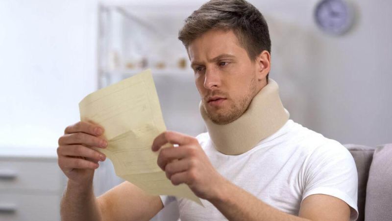 Michigan car accident victim in a neck brace