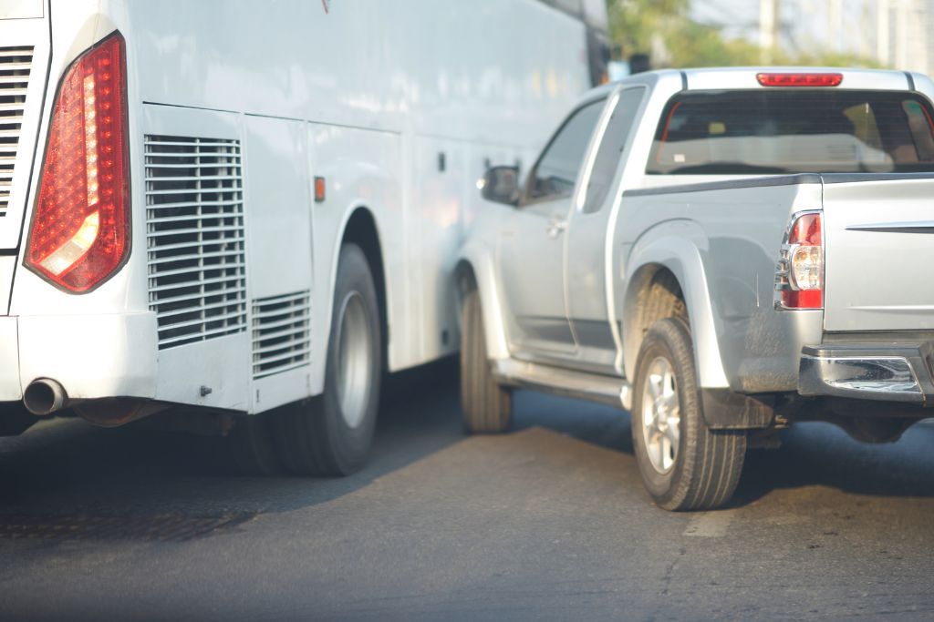 Truck crashing into side of bus