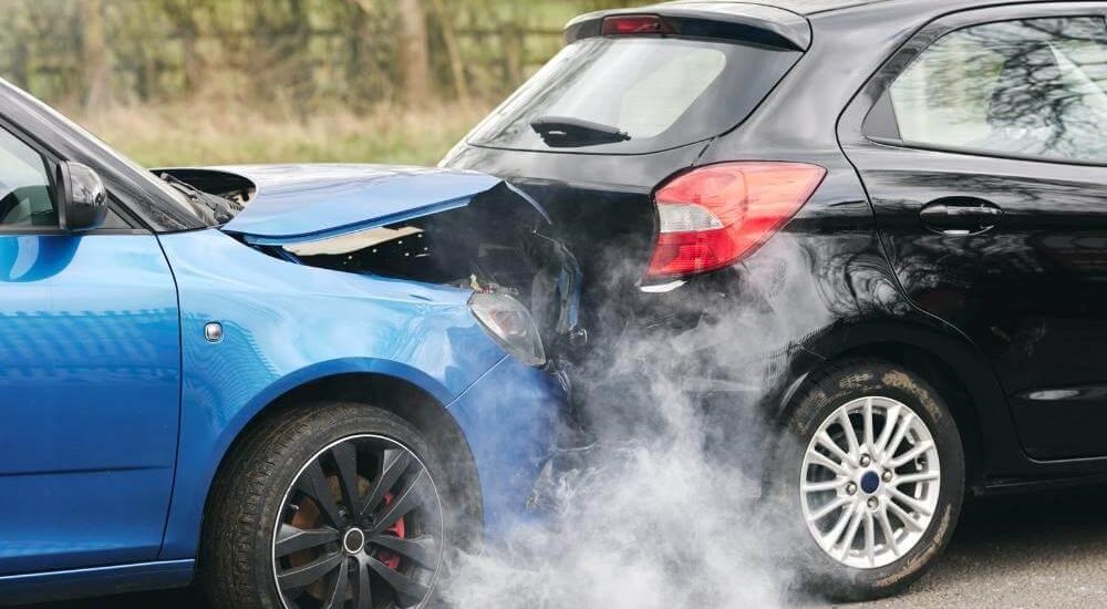Blue car with hood open on the side