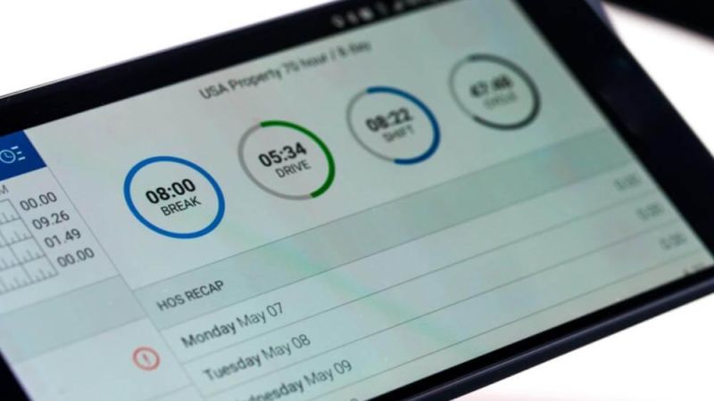 Close-up of a cell phone displaying a clock