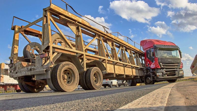 a large truck is driving down the road