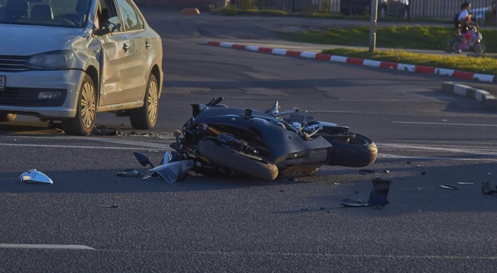 Motorcycle lying on street after accident