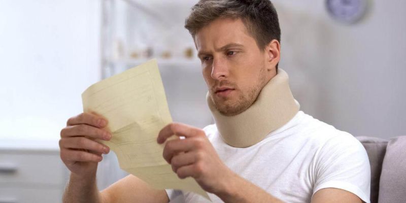 Michigan car accident victim in a neck brace