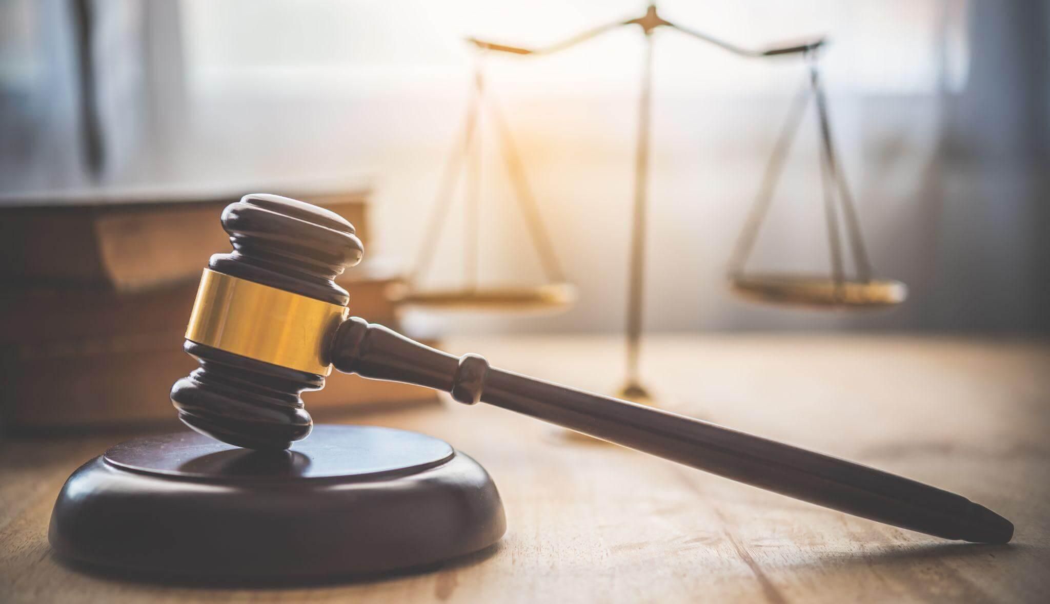 Judge's gavel on wooden table