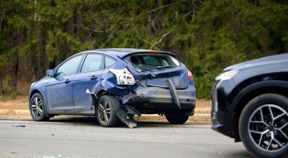 Damaged car involved in a rear-