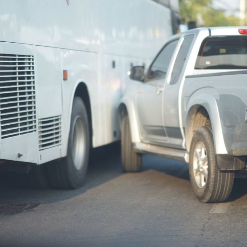 Truck crashing into side of bus