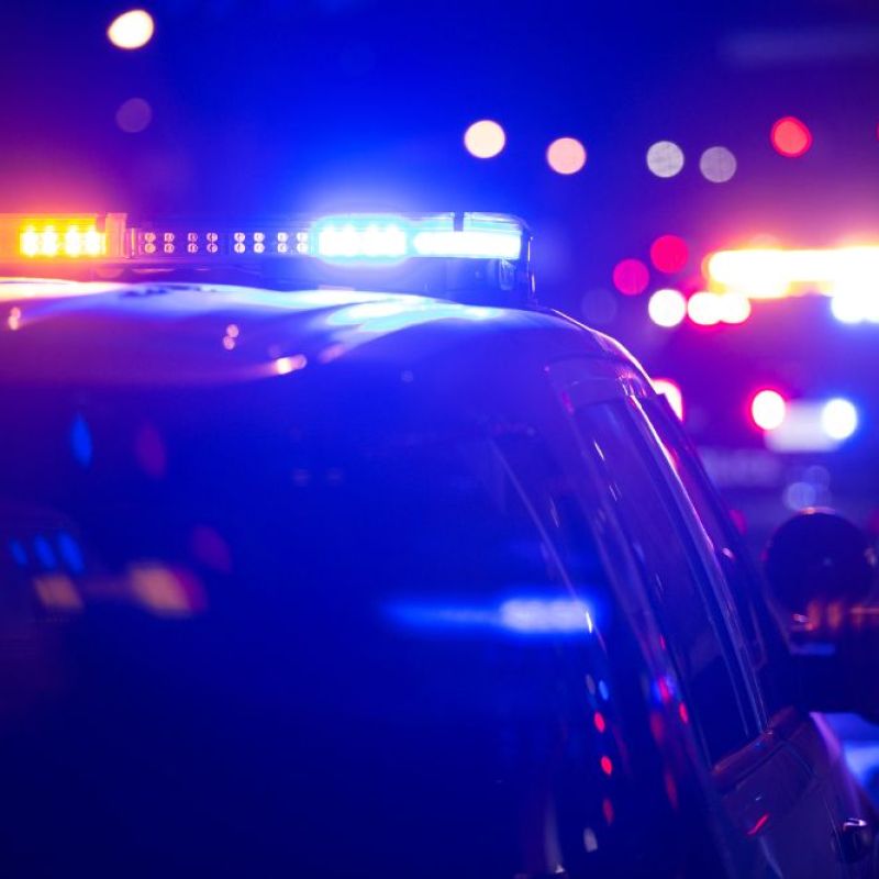 police lights and emergency vehicles light up the night on the streets of Ann arbor Michigan