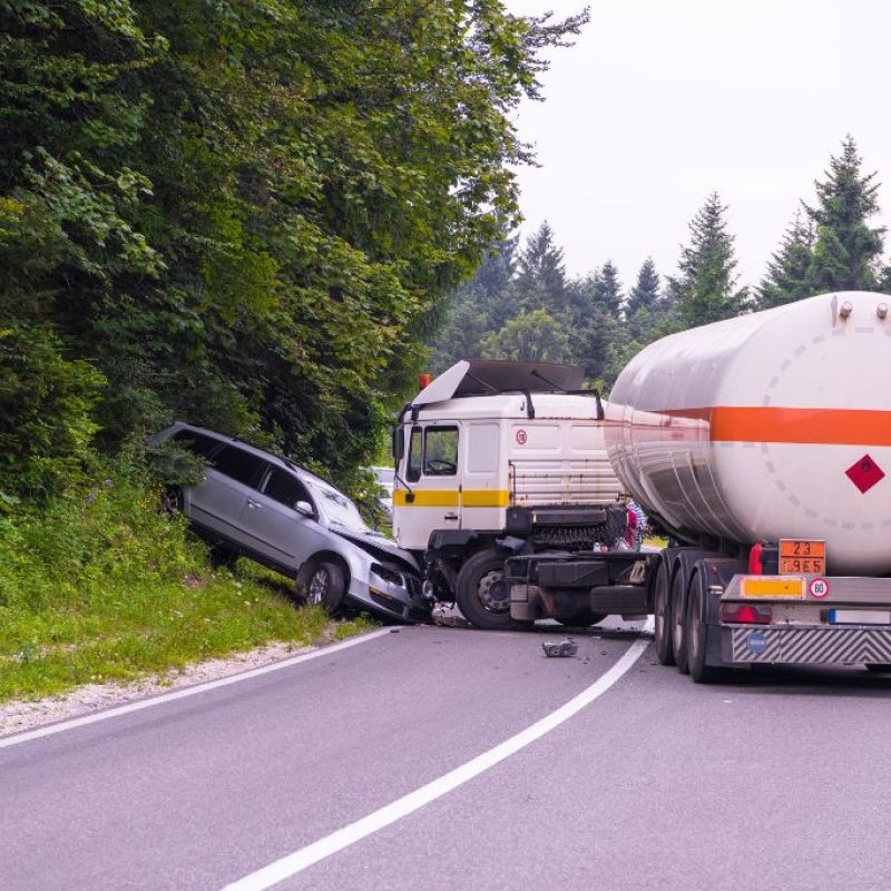 semi truck hitting the front end of a car