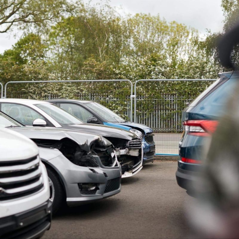 a bunch of cars that are parked in a lot