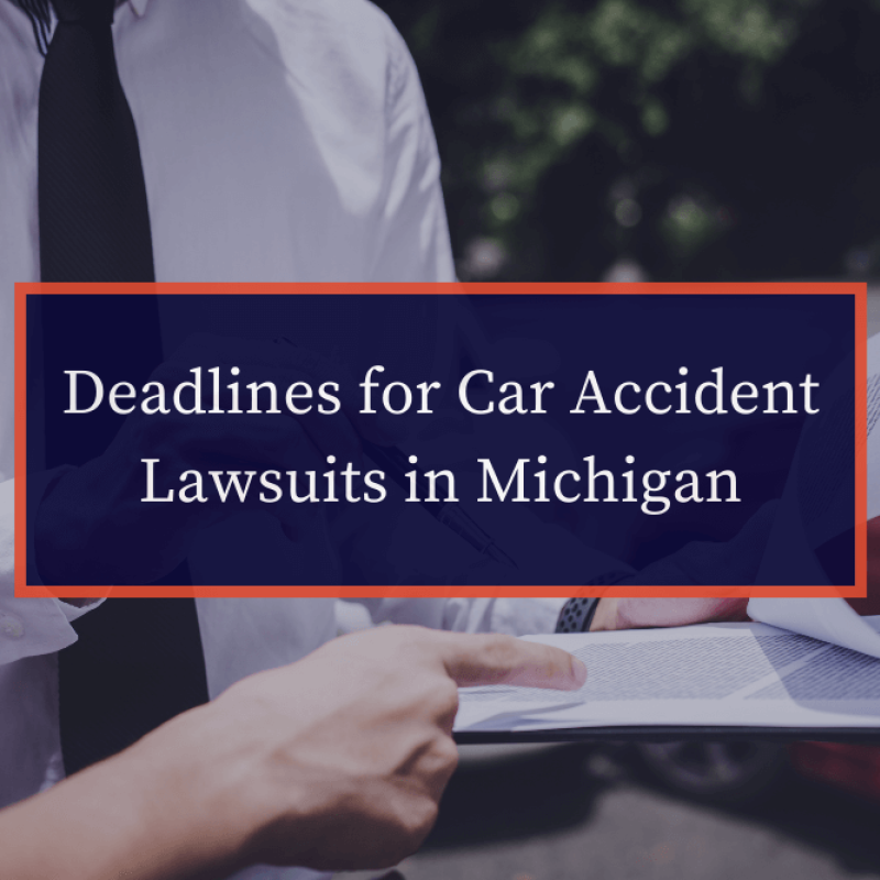 Deadlines for car accident lawsuits in Michigan, legal document review outdoors.