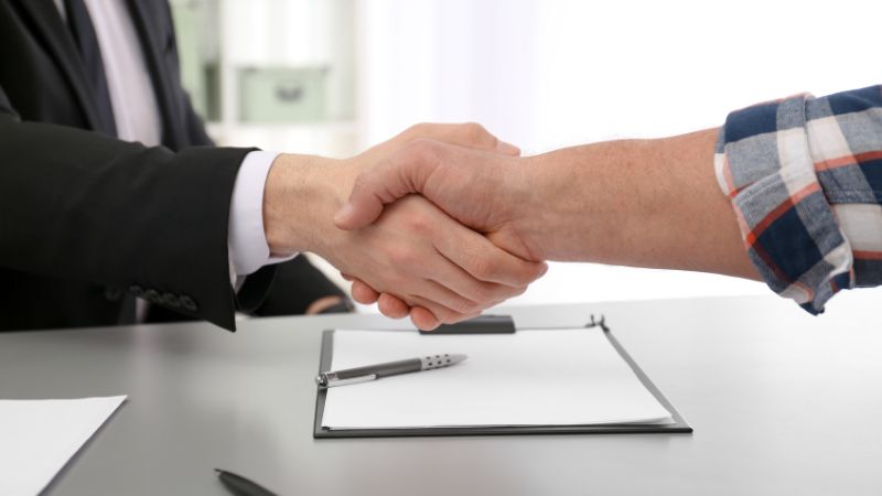 Lawyer shaking hands with a client