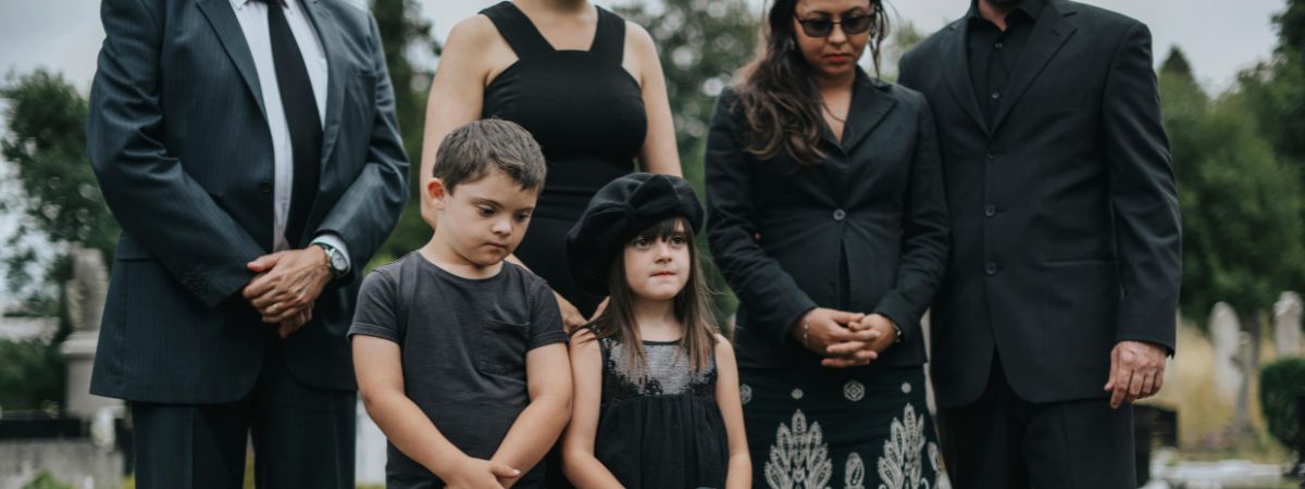 Family wearing all black at a funeral