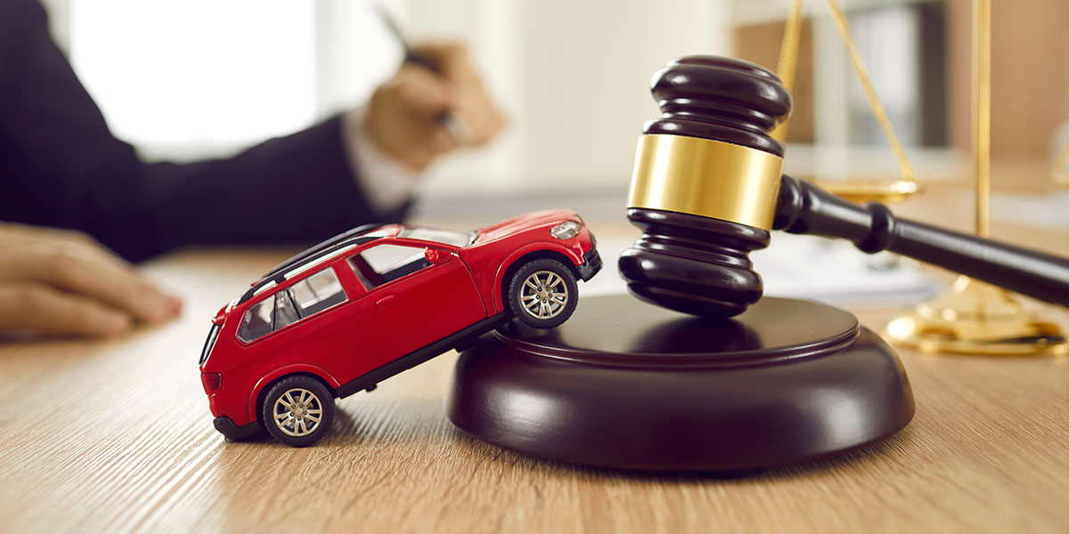 miniature car next to a judge's gavel