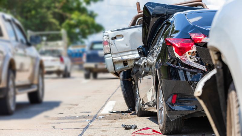 car in a rear end accident with a truck