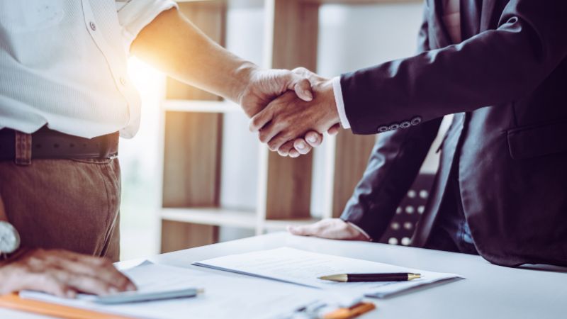Lawyer shaking hands with a client