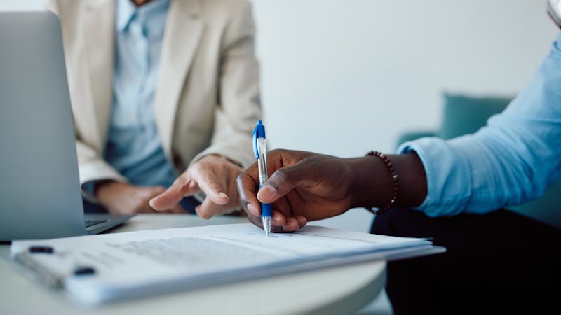 Lawyer and client reviewing property damage claims