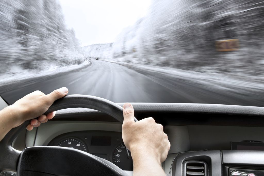 PIP for Motorcyclists in Michigan | Matz Injury Law Man driving down a highway covered in snow