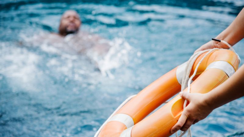 matz footer cta | Matz Injury Law life preserver being thrown to a man in the water