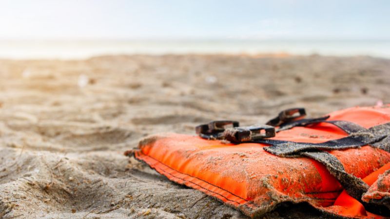 | Matz Injury Law life preserver laying on a beach