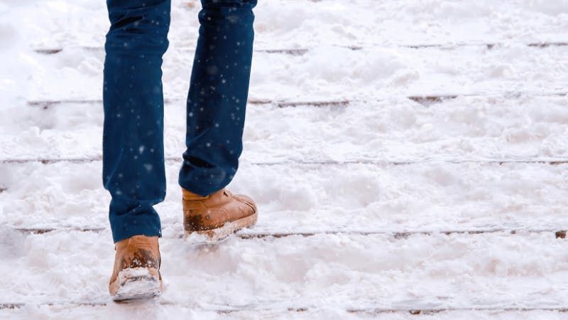 walking on snow-covered stairs