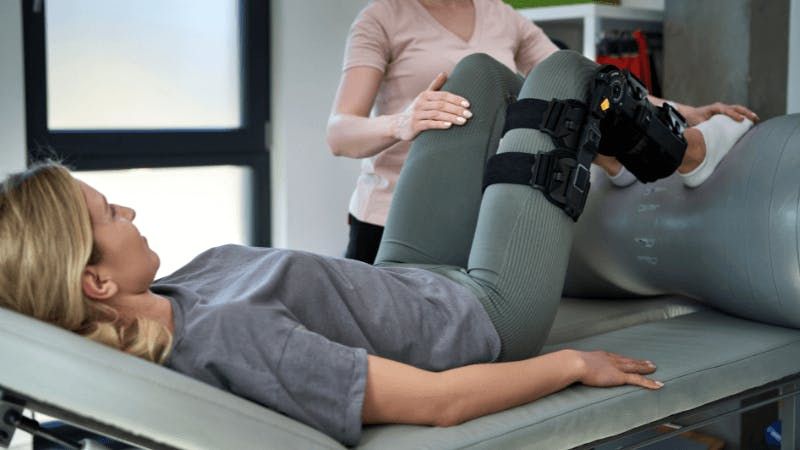 woman doing physical therapy with doctor.