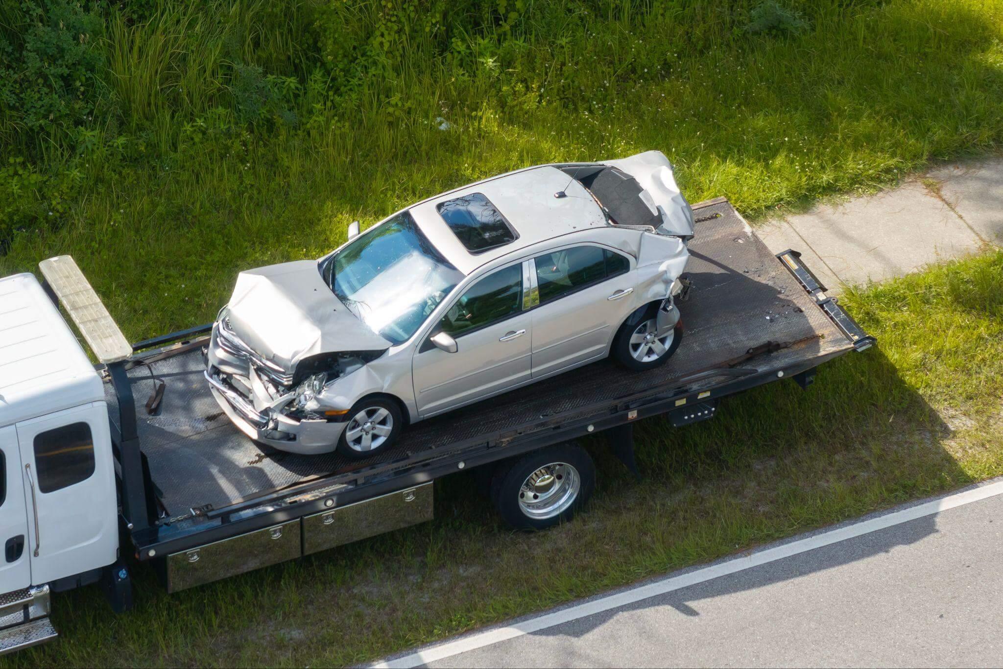 a car is on the back of a tow truck