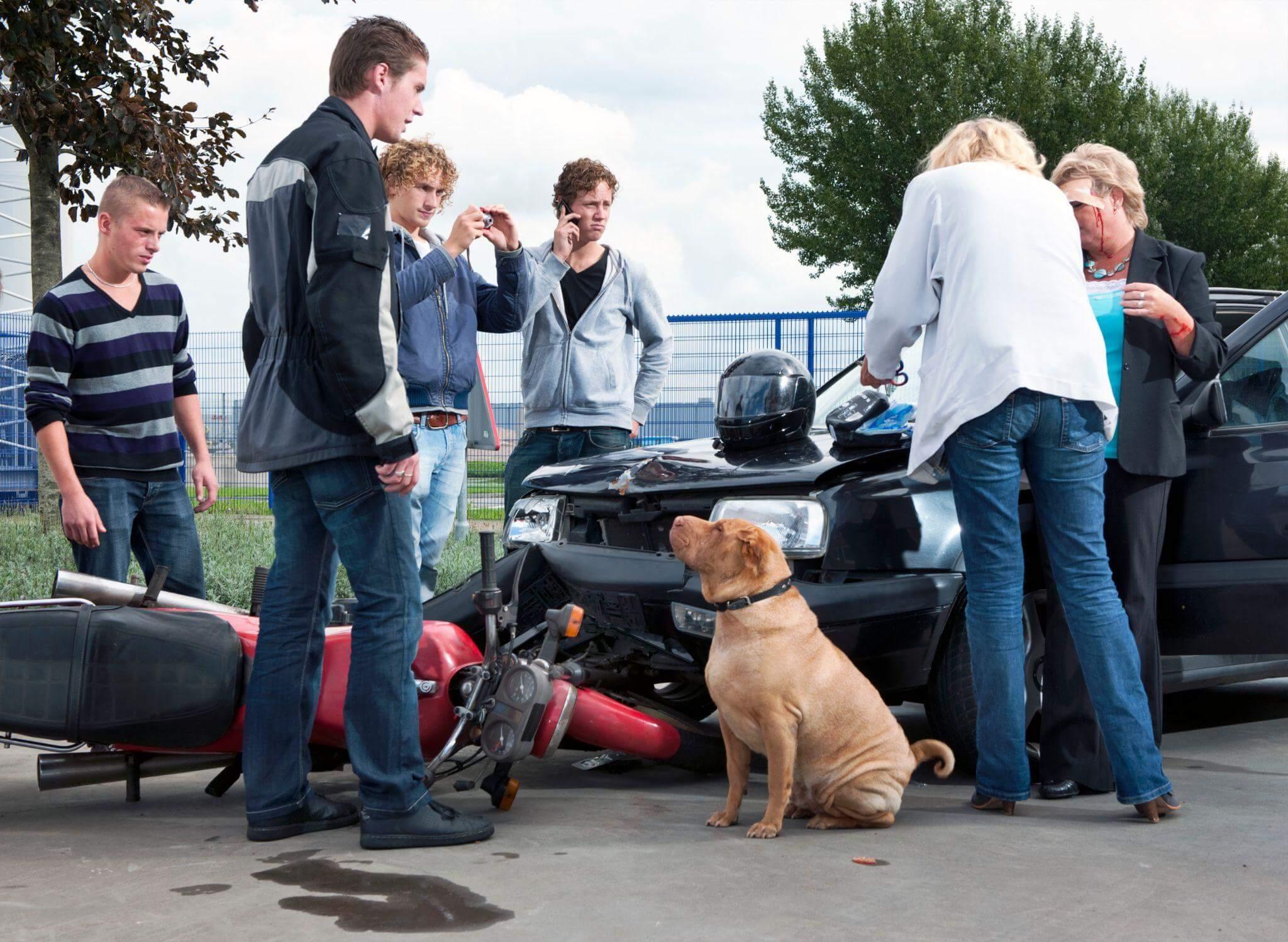 a group of people standing around a motorcycle