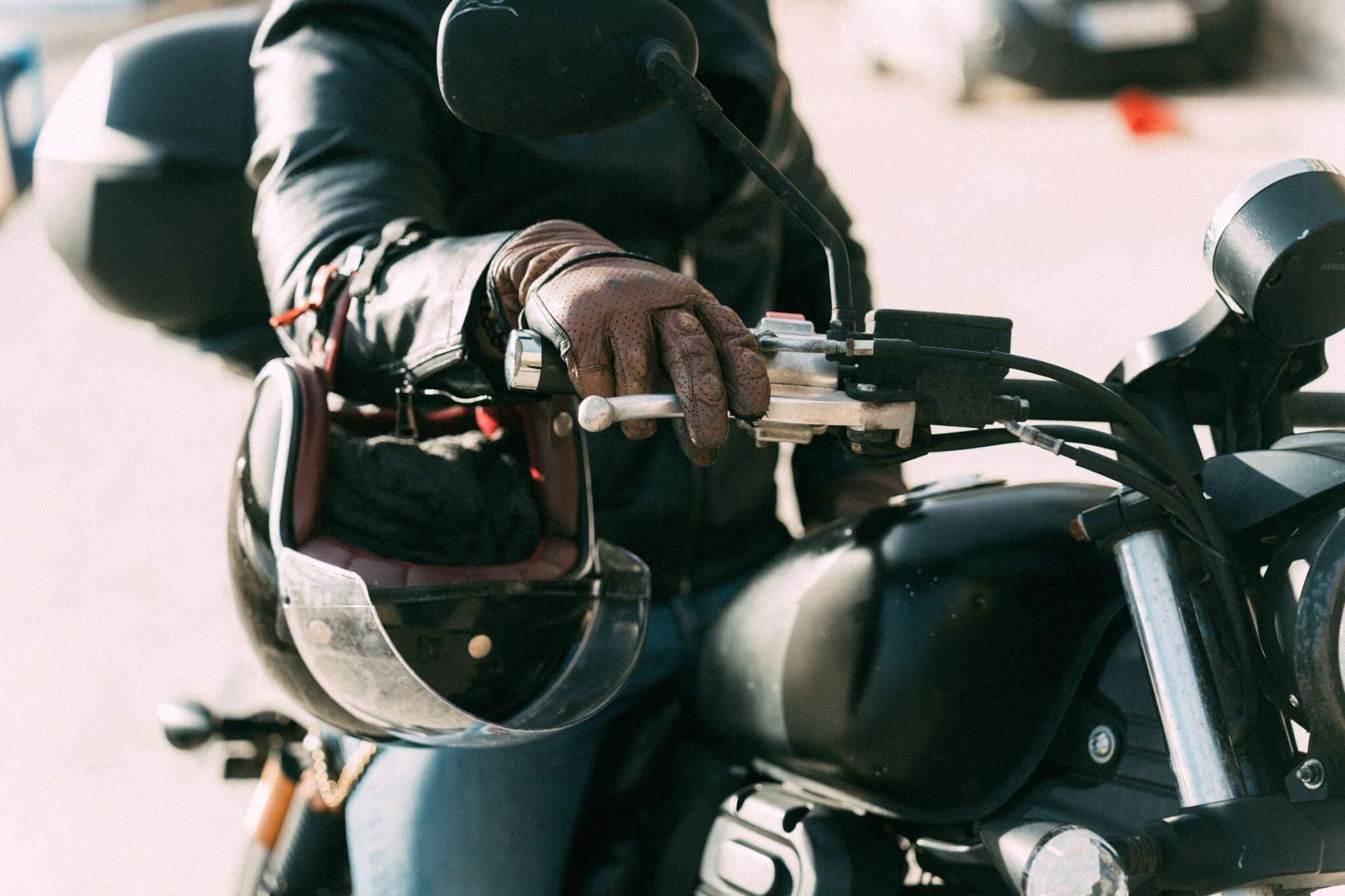 Person riding motorcycle close up