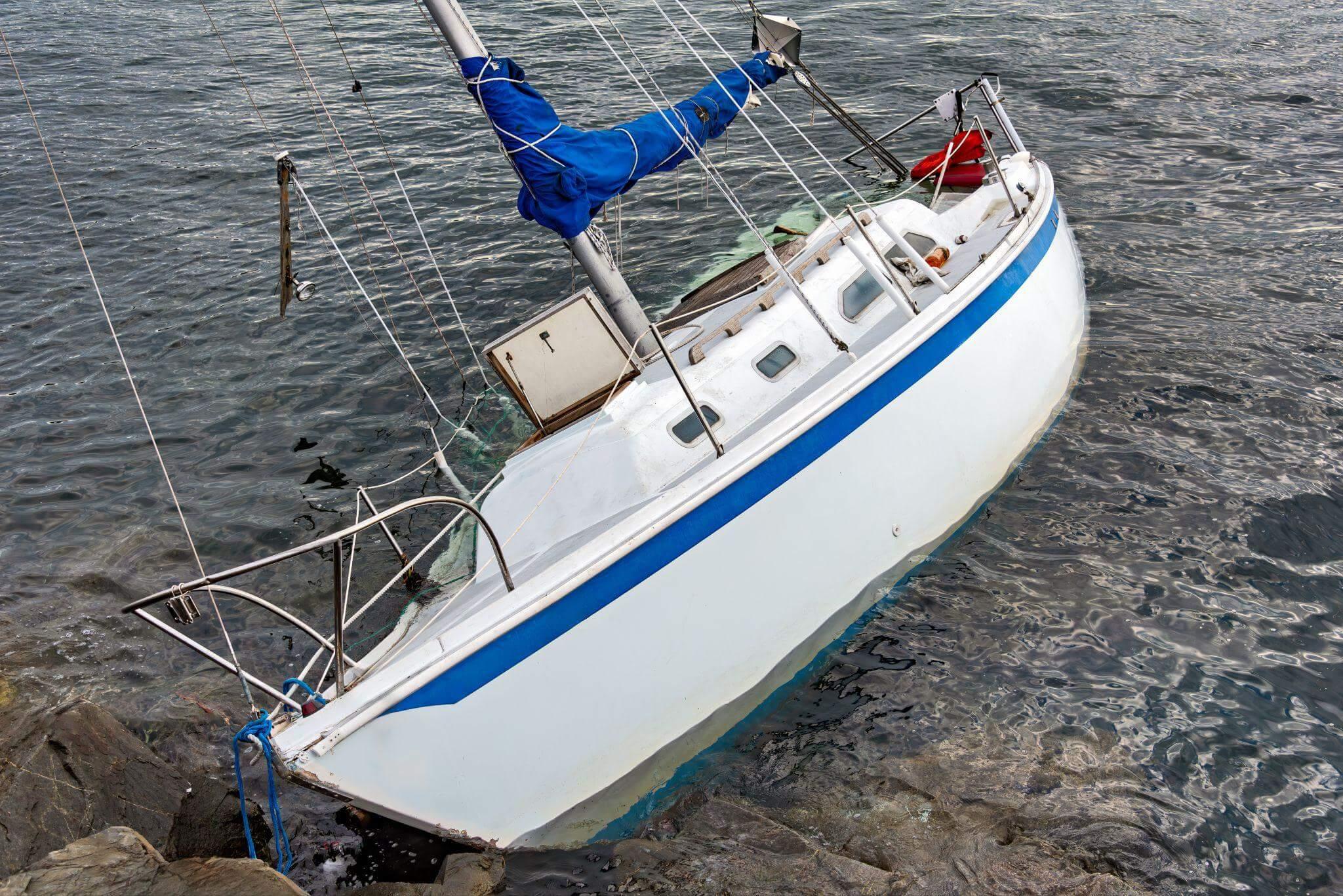 White and blue sailboat on water post-Michigan boating accident