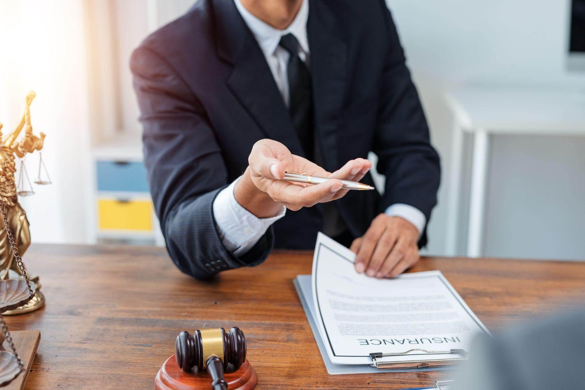 Businessman signing a document in formal attire