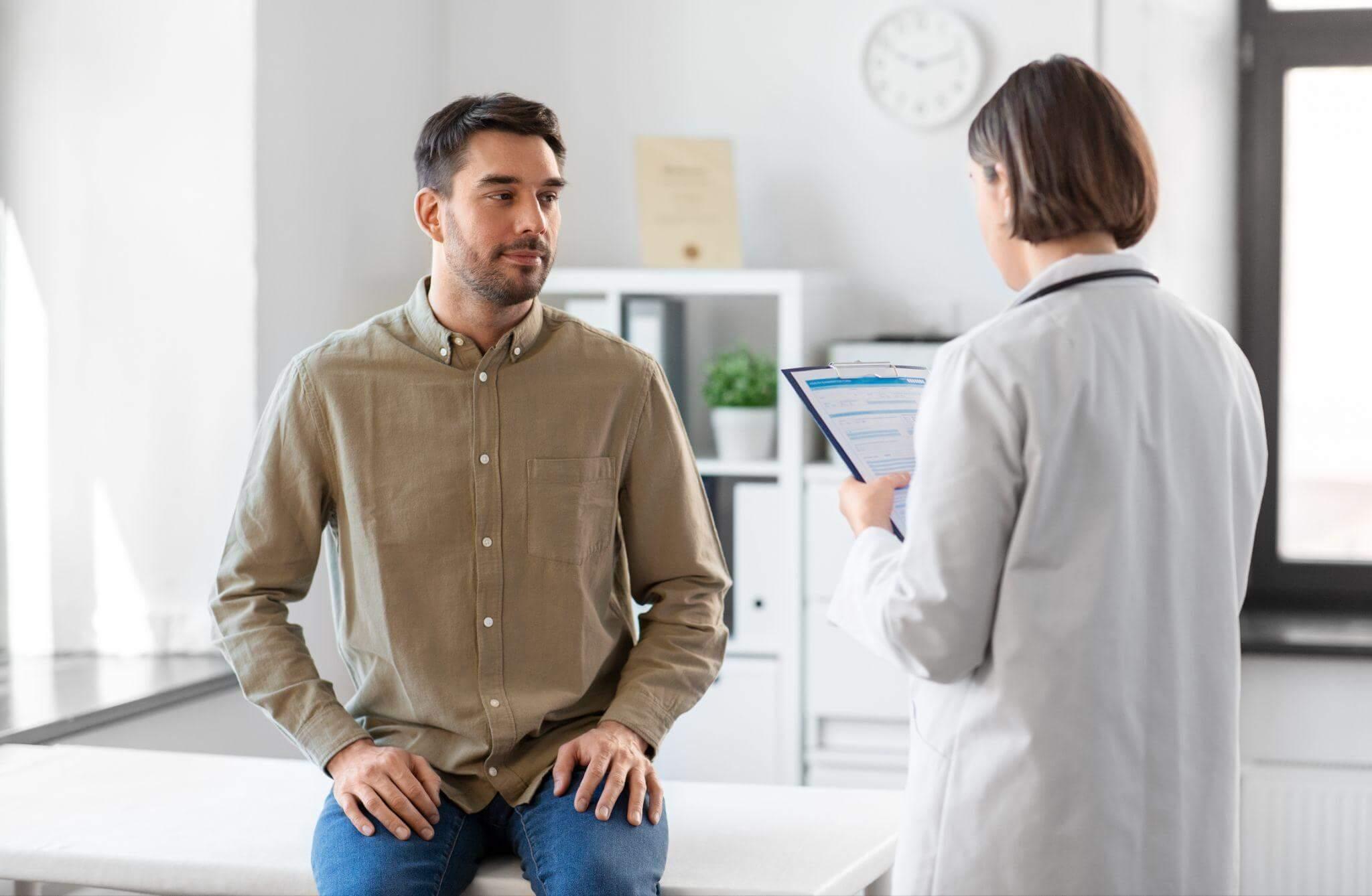 Doctor consulting patient in medical office