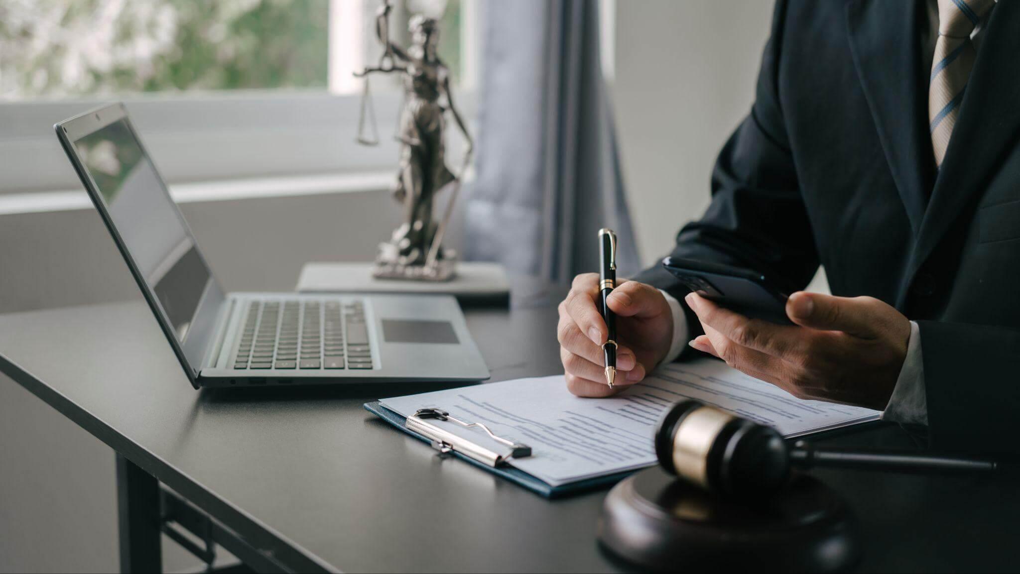 Person working on laptop at desk