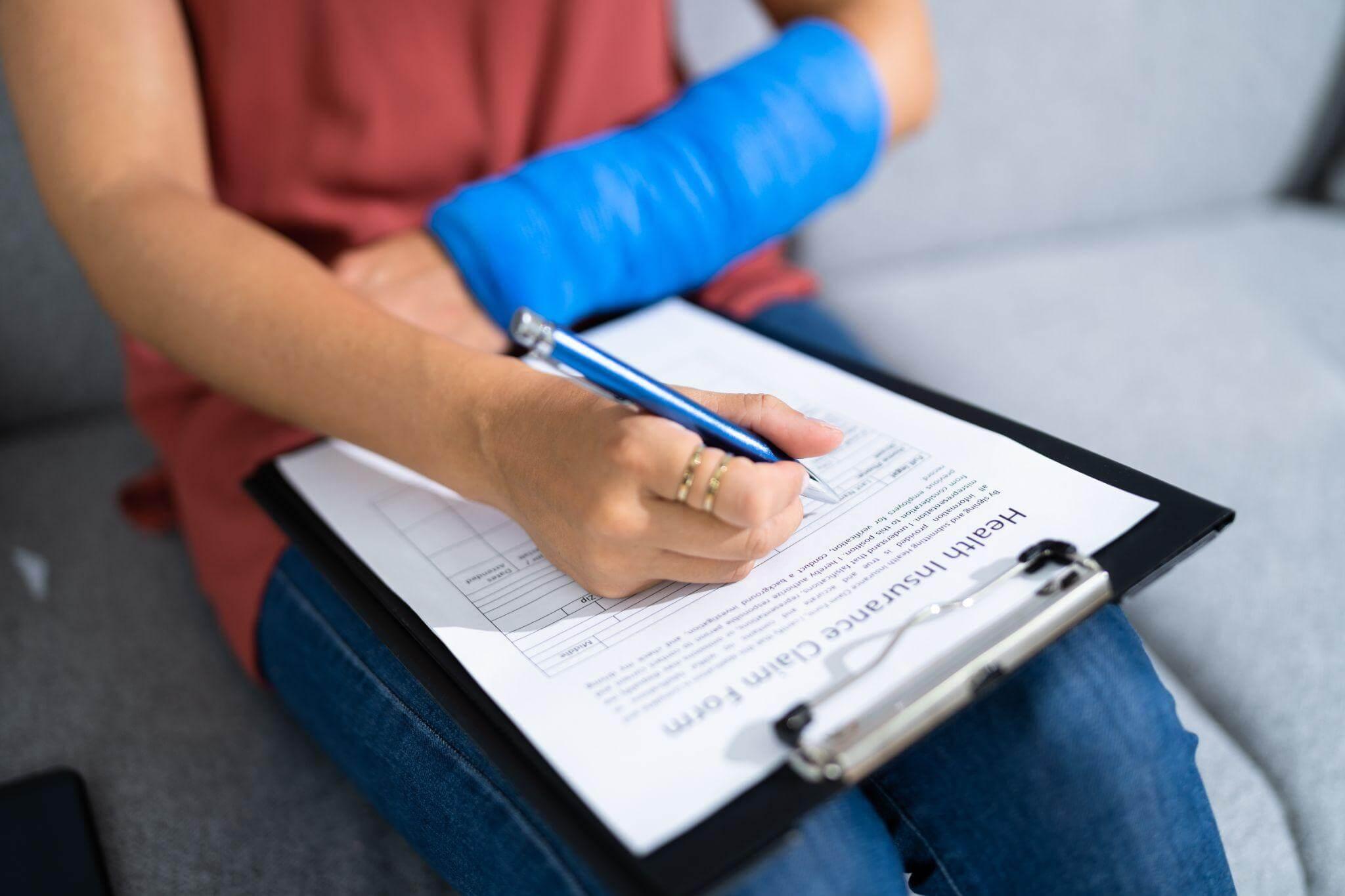 a person sitting on a couch writing on a clipboard