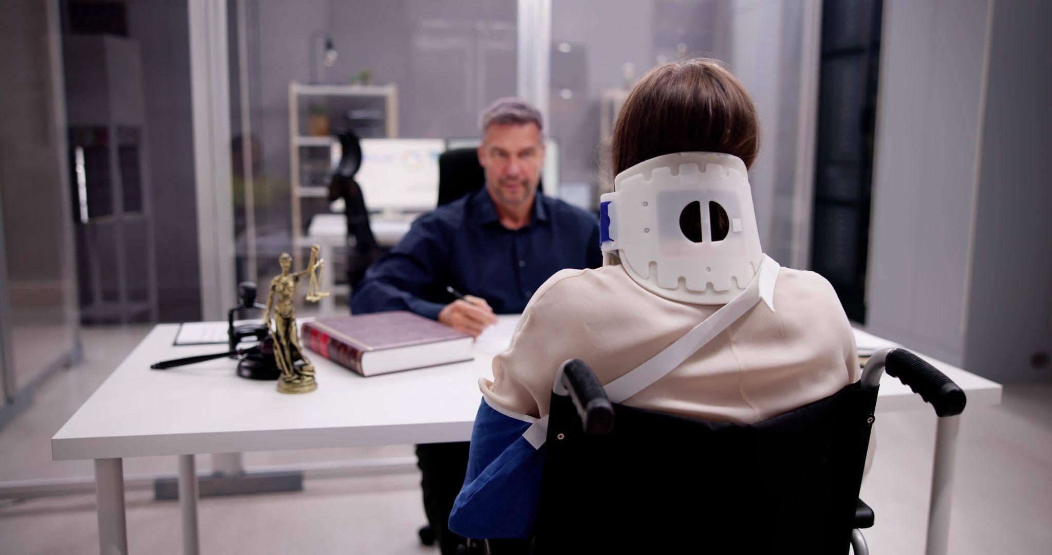 a man sitting in a wheel chair with a mask on his face