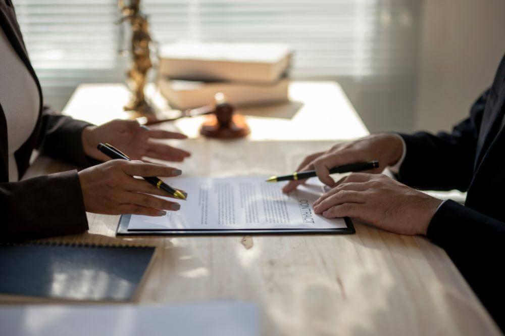 Couple sitting at table, likely discussing wrongful death