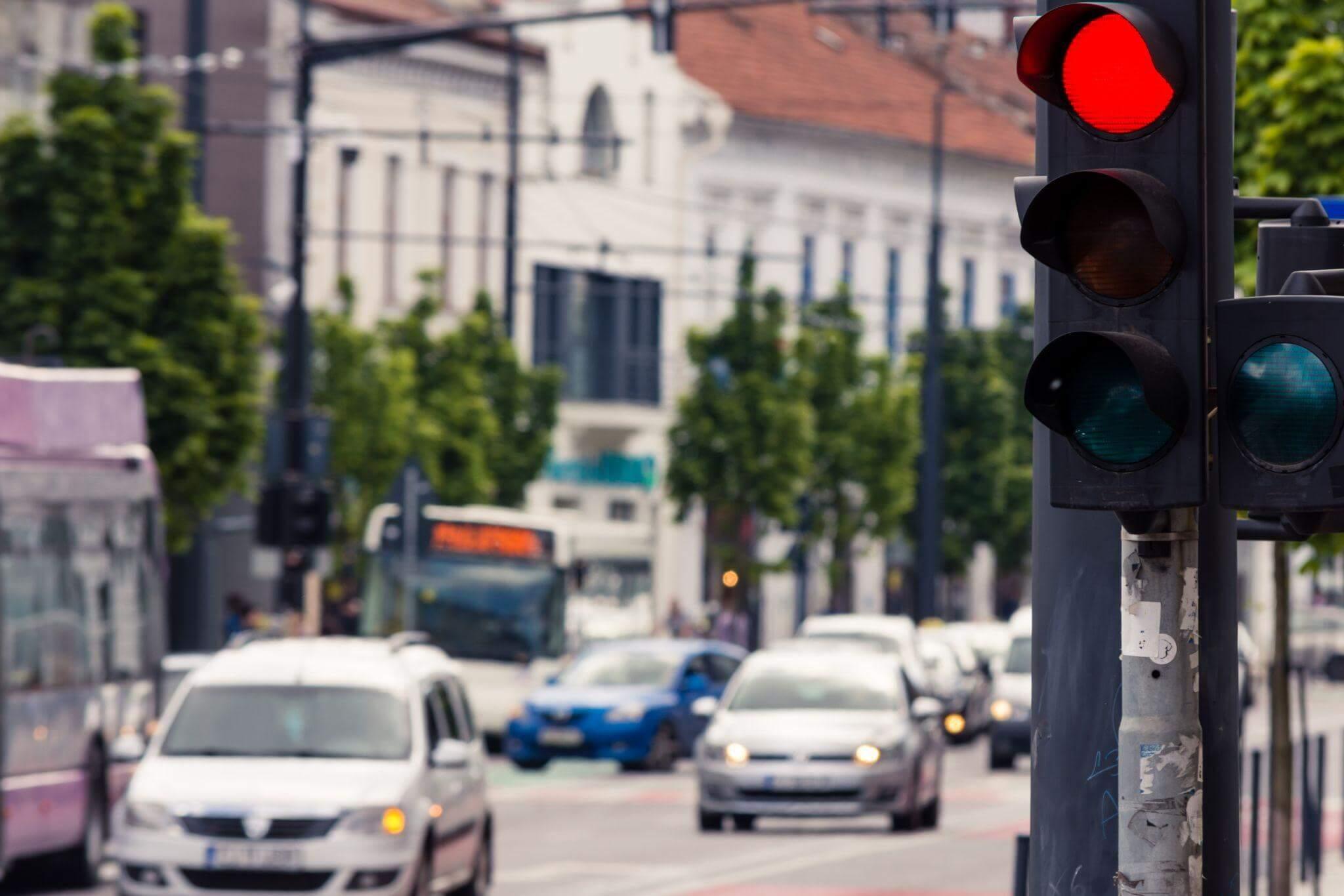 Red traffic light on a city street, relevant to