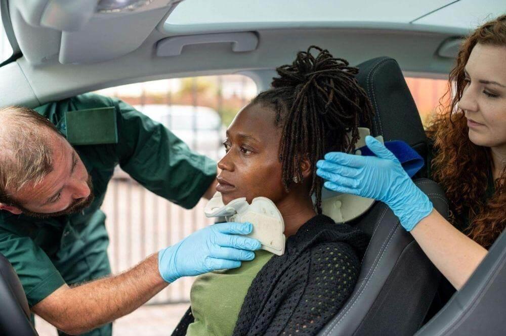 Woman getting her hair styled inside a car.