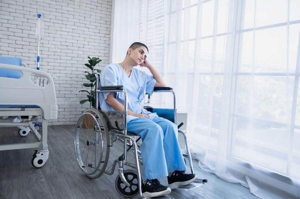 Woman in a wheelchair in a hospital room