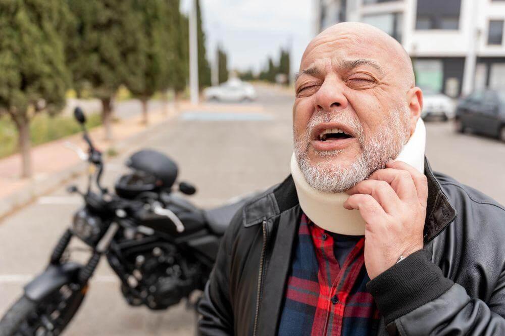 Man in neck brace standing next to