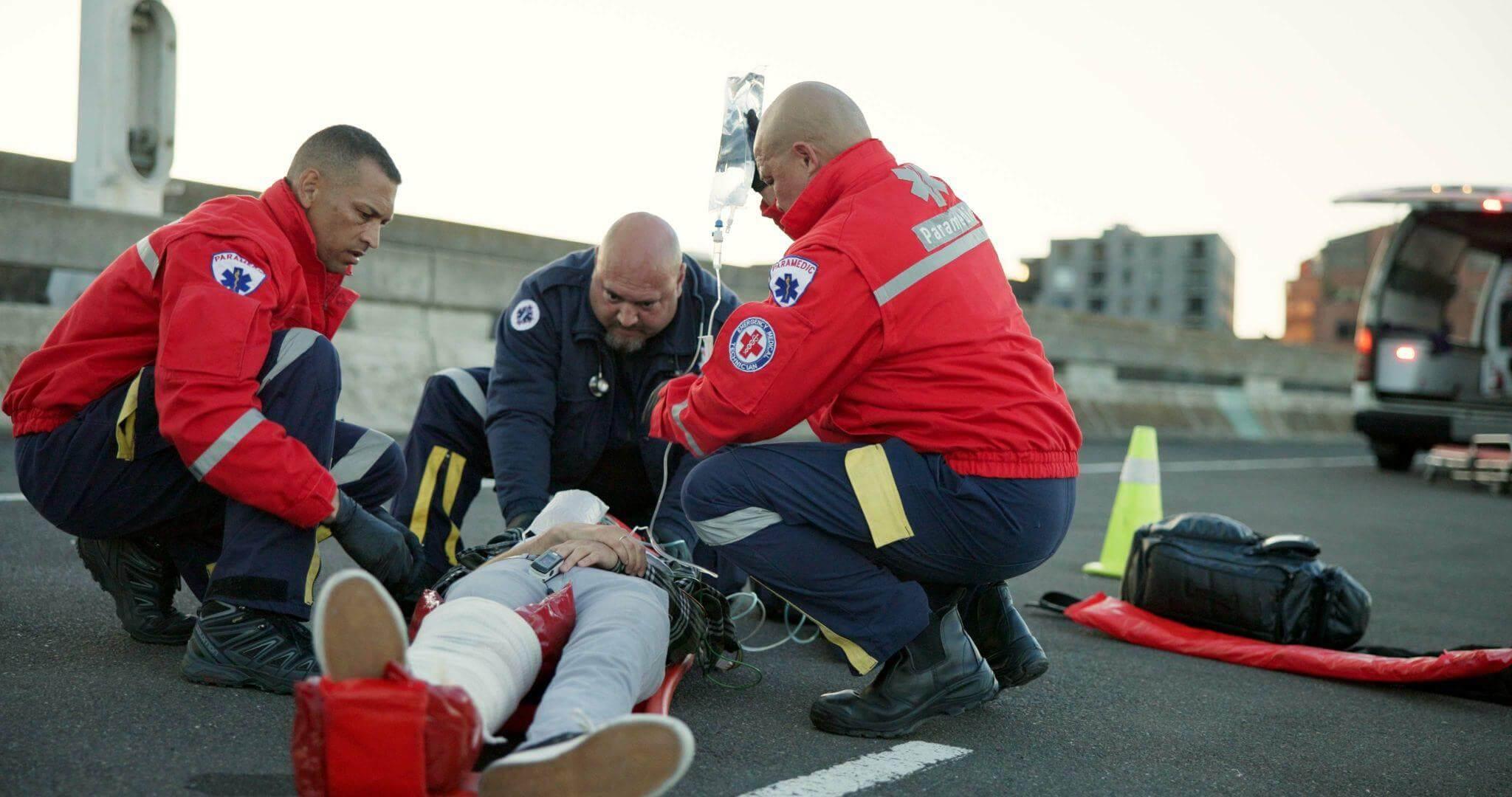 Emergency personnel tending to victim after delivery