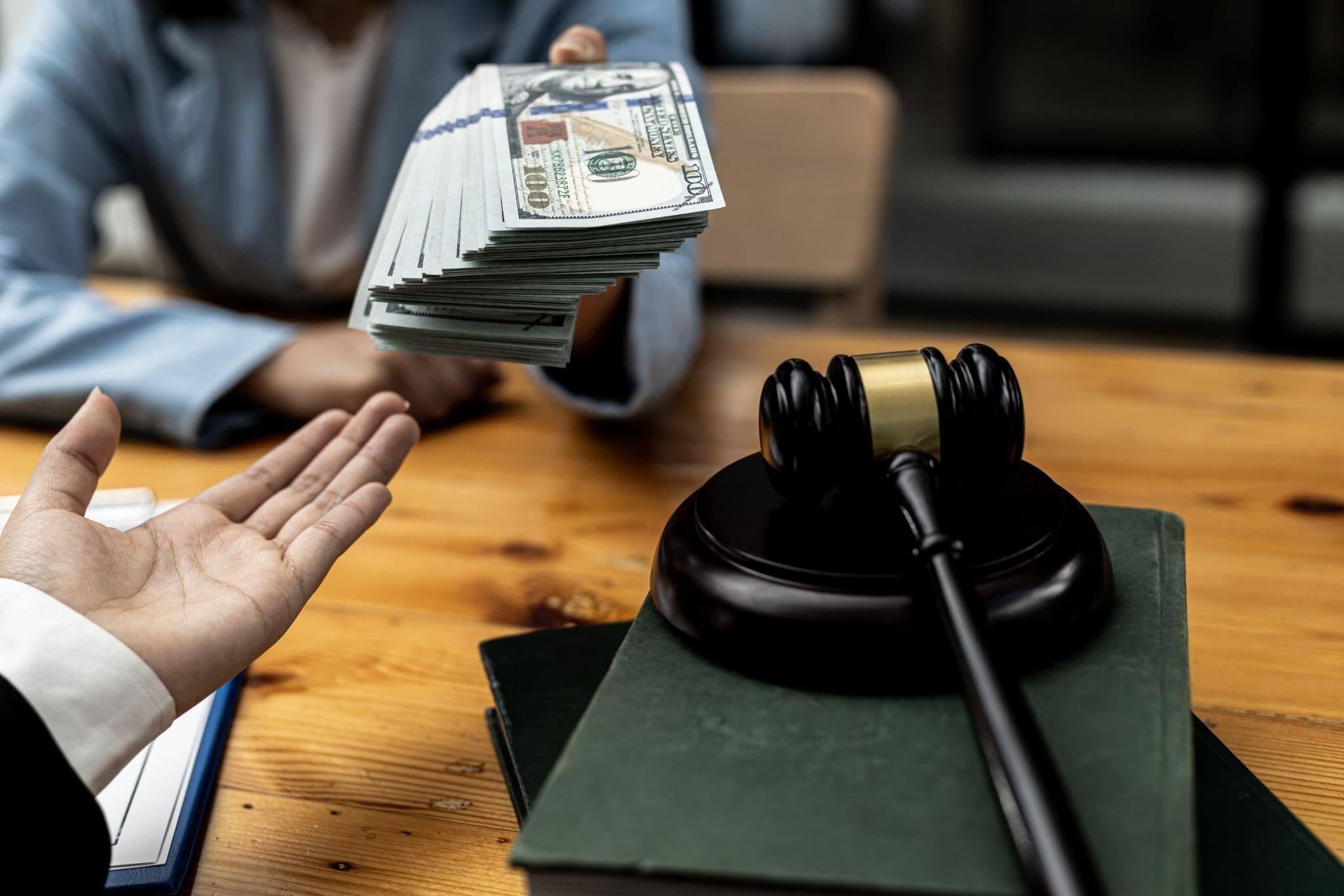 Person holding a stack of money in front